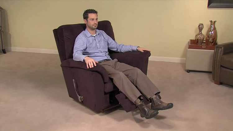 A Man Sitting On A Recliner Chair